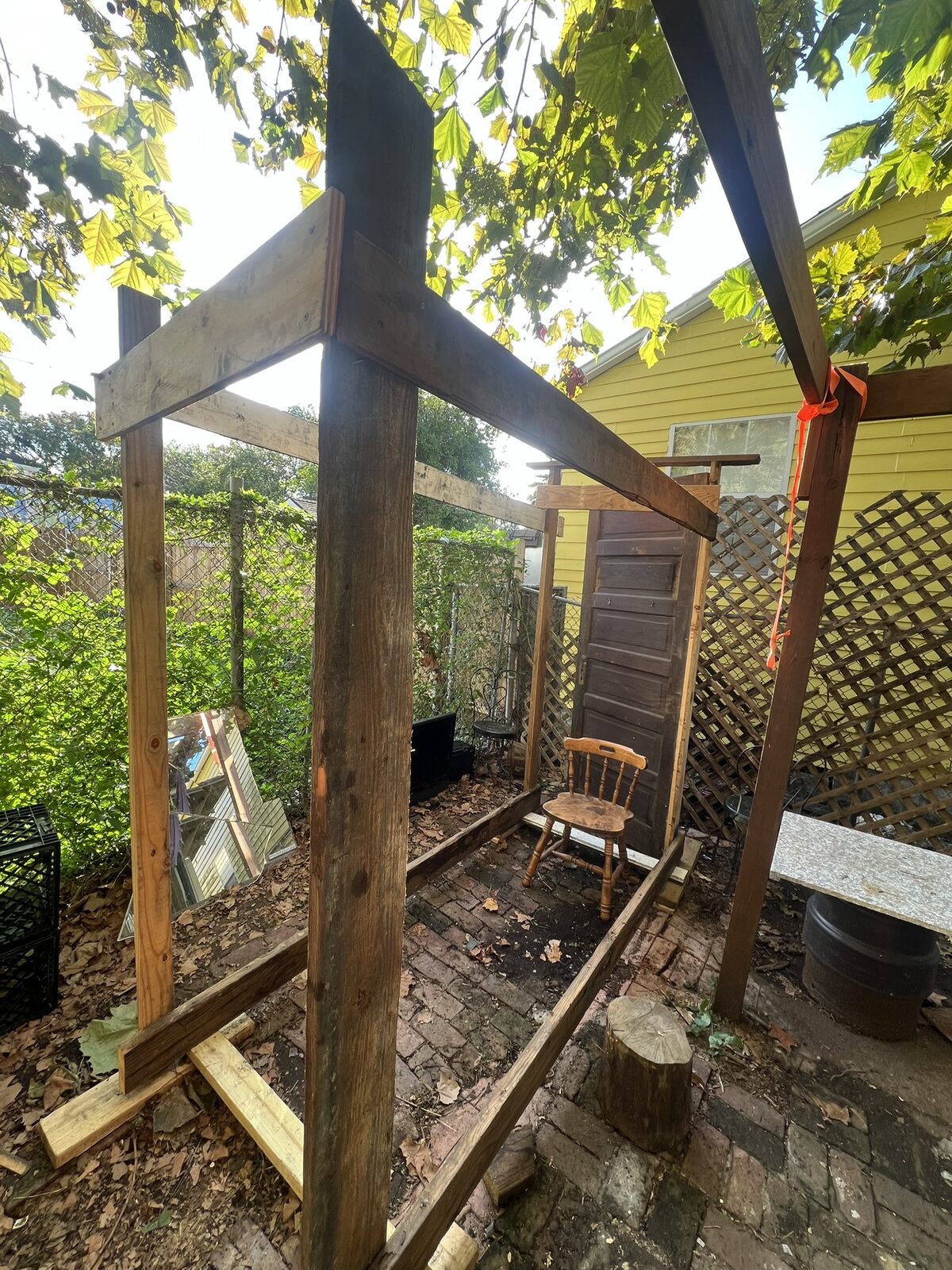 A simple rectangular wood frame standing in my backyard — the beginning of the maze structure